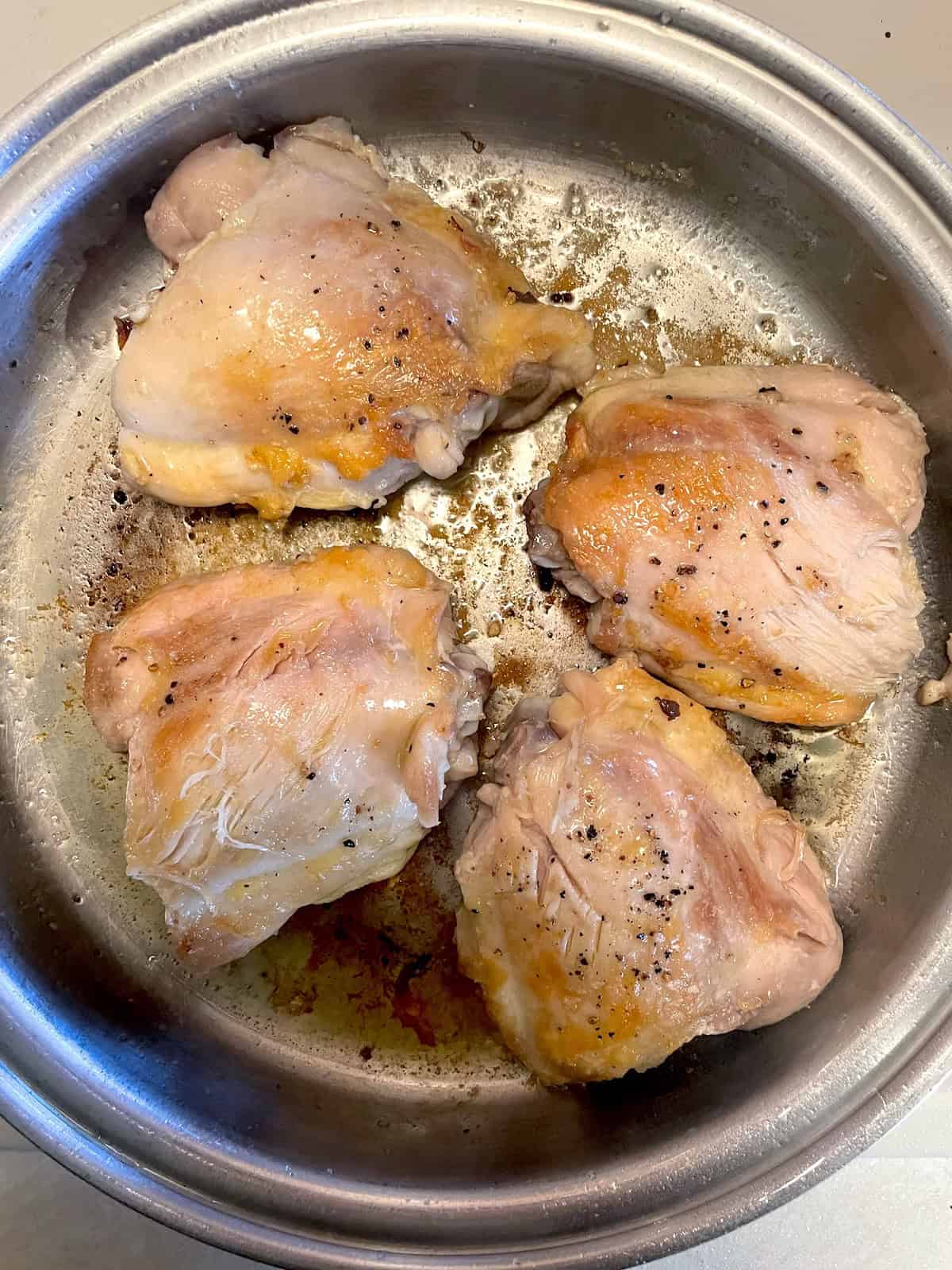 Slow-Cooker Chicken Tagine with Dried Fruit, Olives and Chickpeas.Browning Chicken in skillet