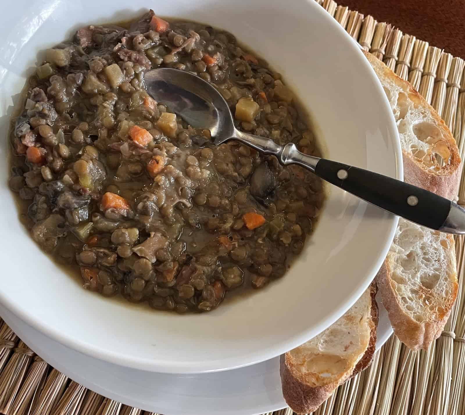 Aromatic Lentil and Ham Soup with Apples and Mushrooms -- Finished recipe in a soup bowl.