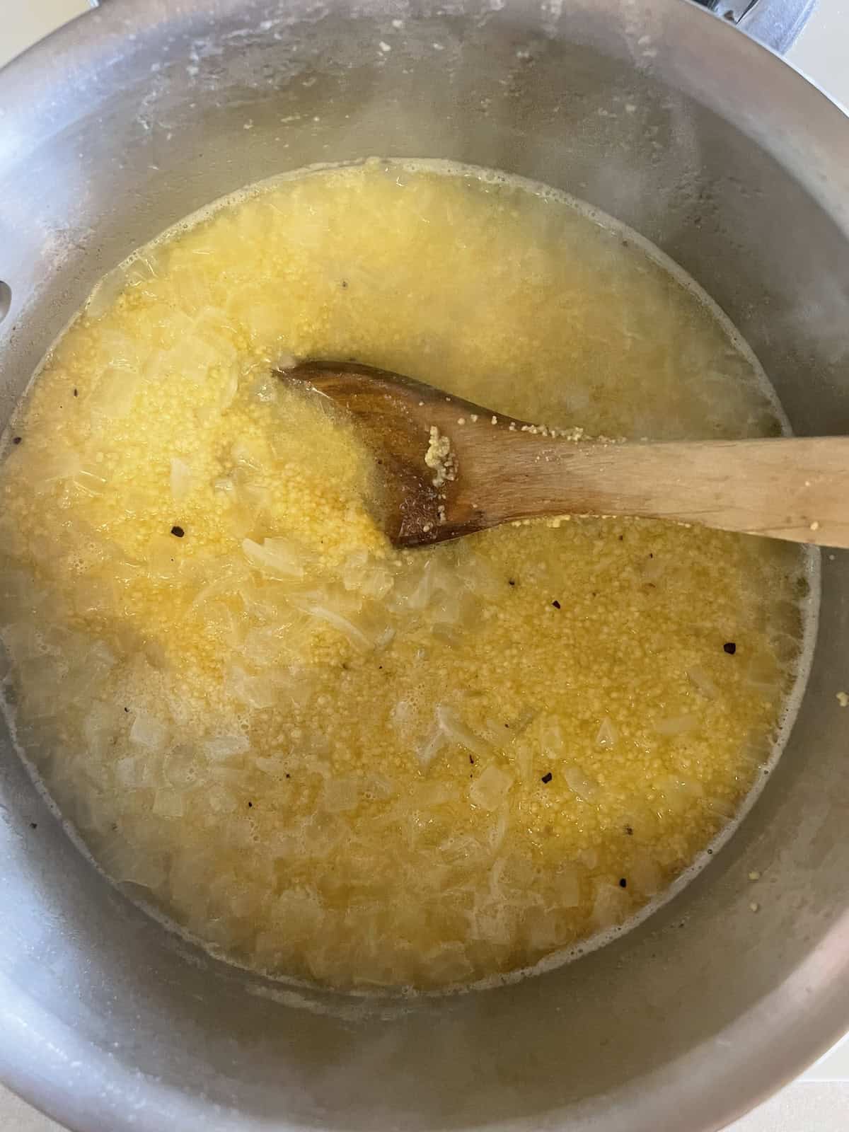 Couscous with Pine Nuts (Pignoli) and Parsley -- adding couscous