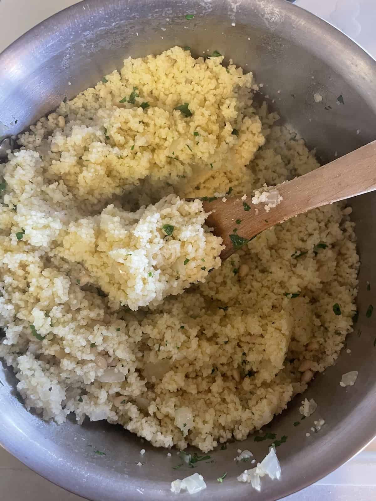 Couscous with Pine Nuts (Pignoli) and Parsley -- fluffing to combine