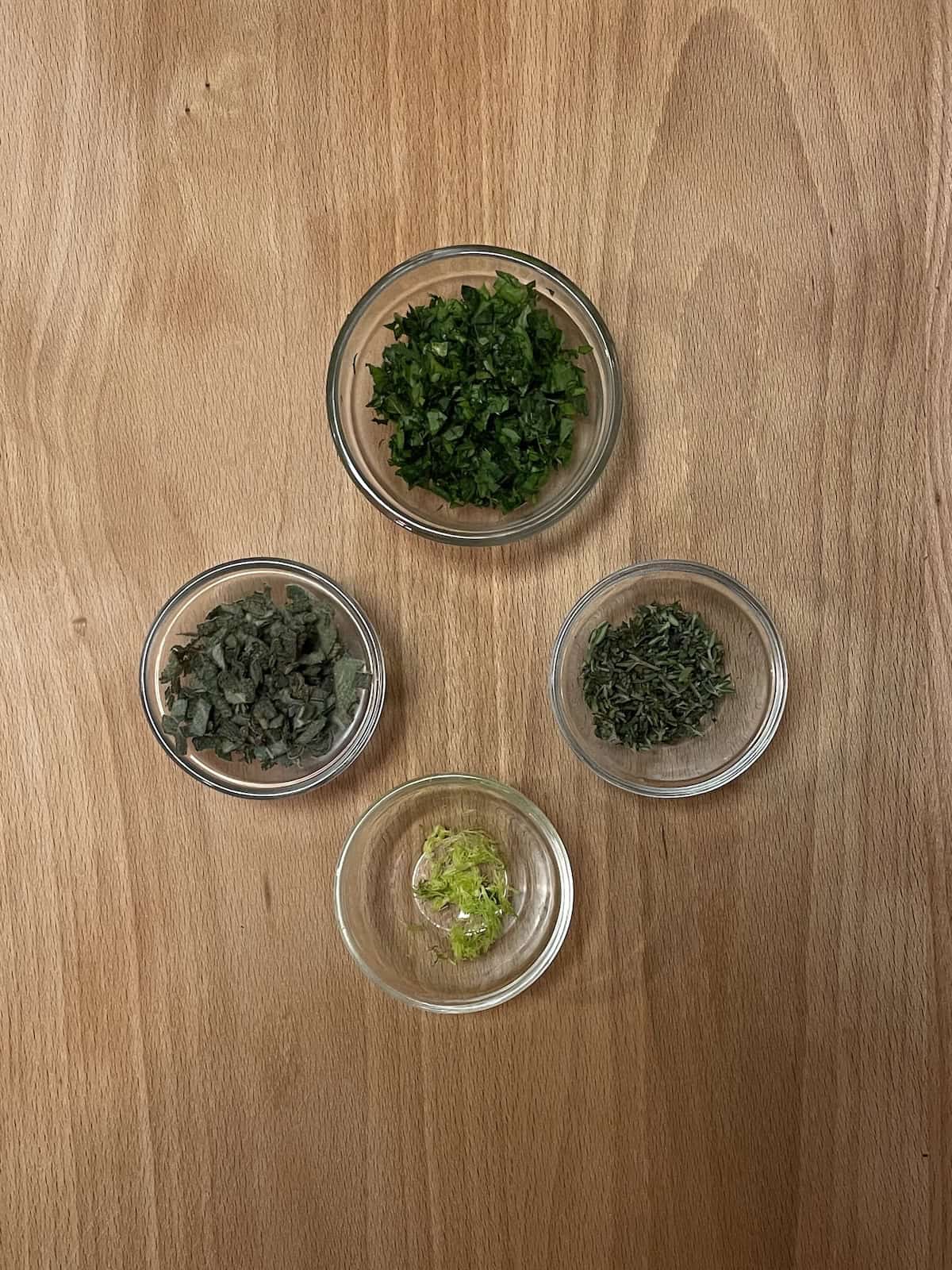 herbs in glass dishes