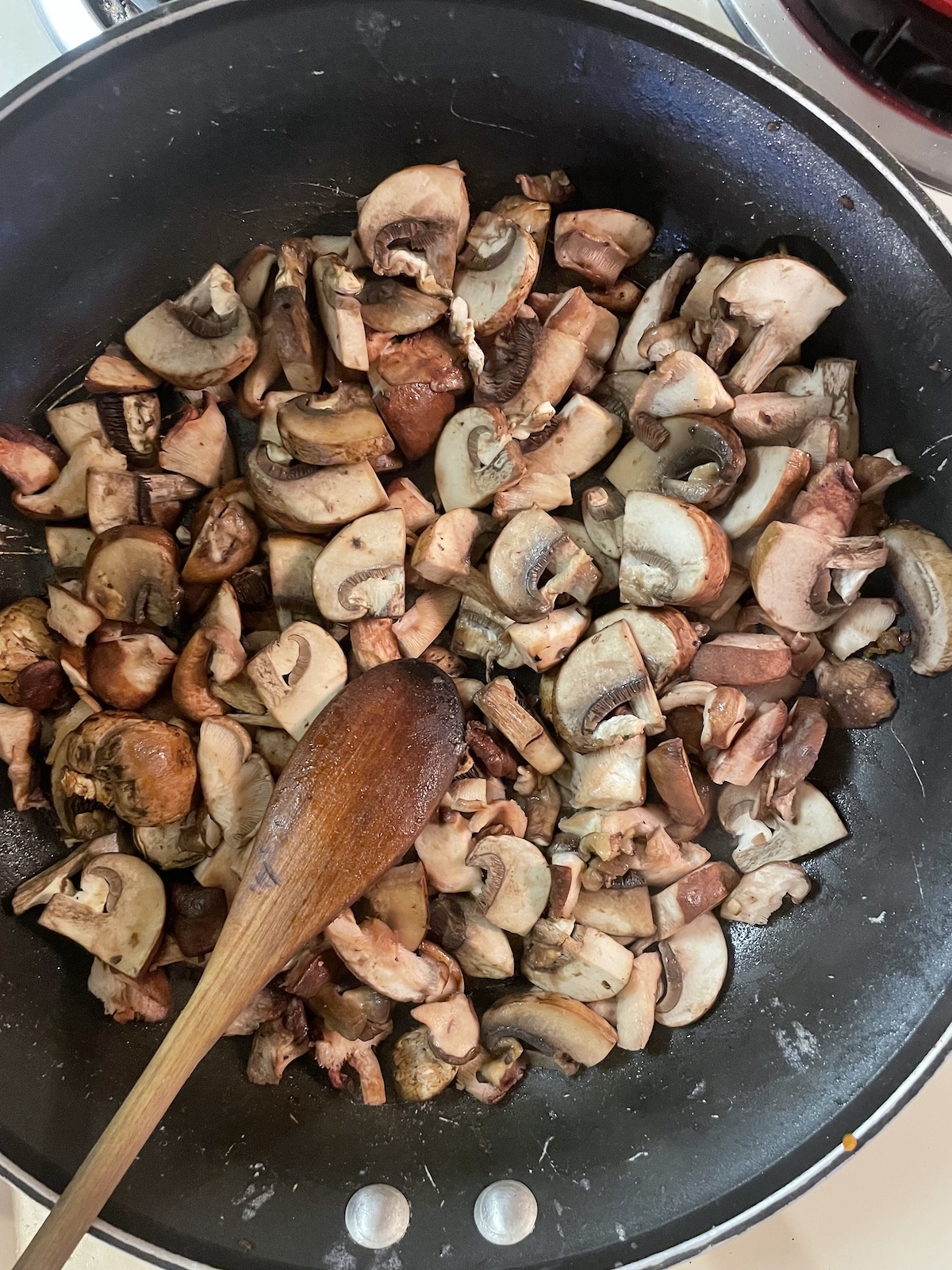 uncooked mushrooms in skillet