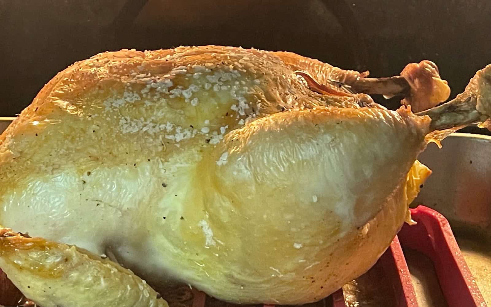 Lemon and Herb Roasted Chicken roasting in oven