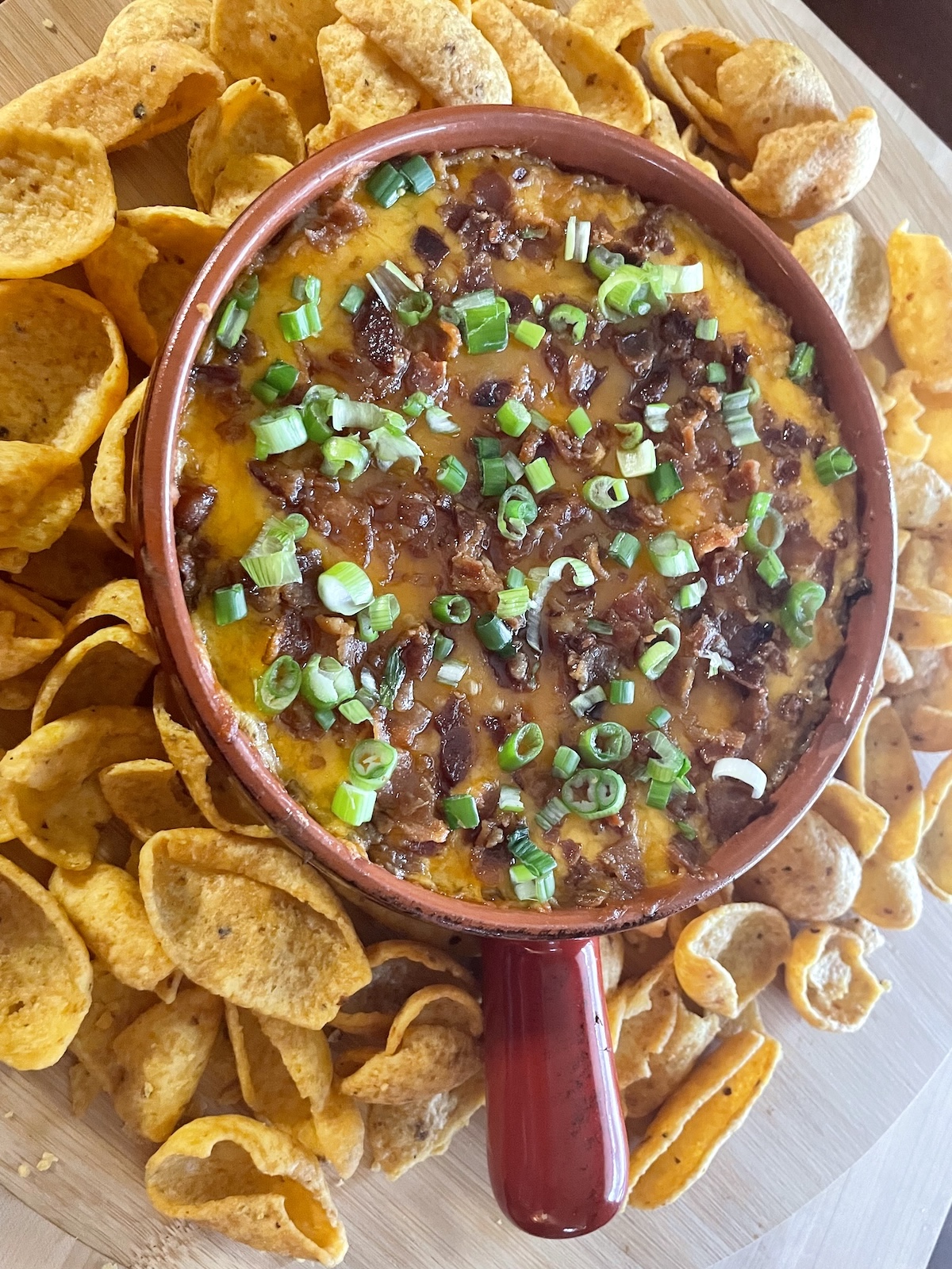 Baked Cheddar, Bacon and Chutney Dip -- topped with reserved scallions and served with corn chips