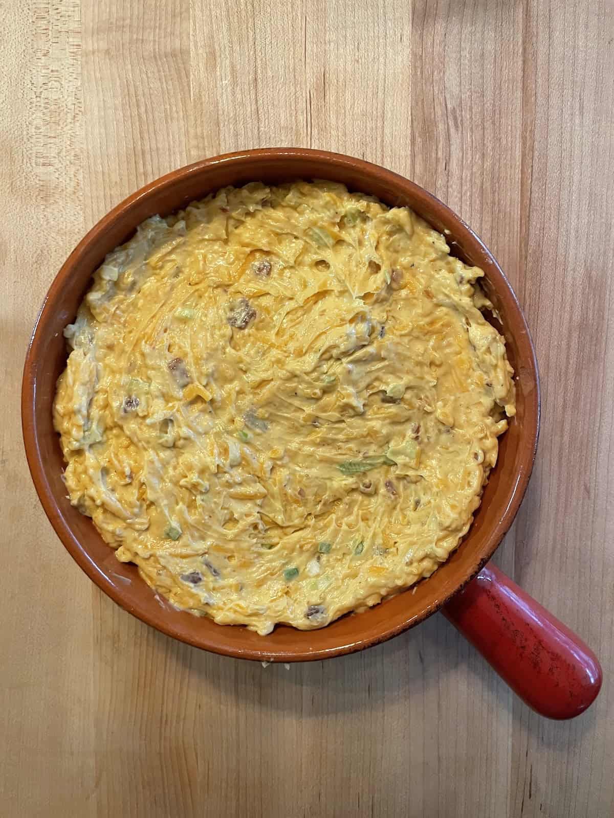 Baked Cheddar, Bacon and Chutney Dip - transferred to a baking dish