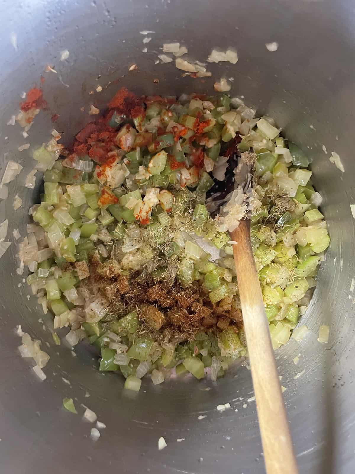 Pinto Bean Soup with Ham and Andouille -- adding spices to pot