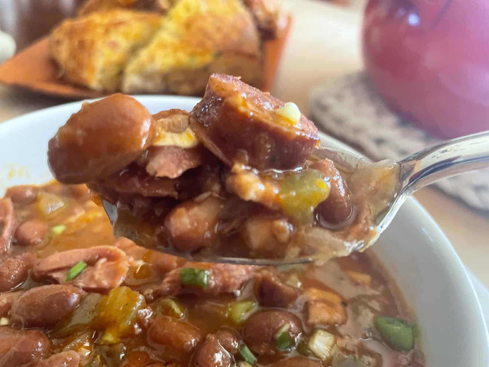 Pinto Bean Soup with Ham and Andouille -- finished soup on a spoon