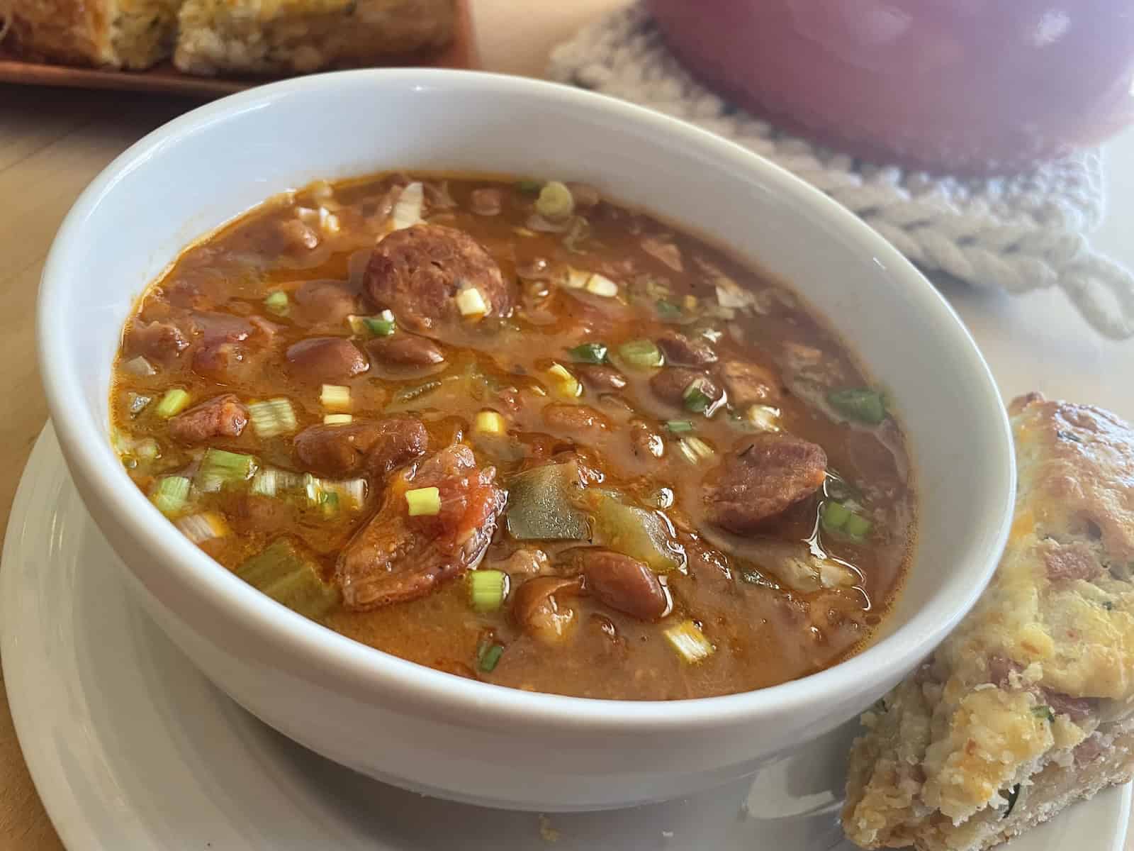 Pinto Bean Soup with Ham and Andouille in a bowl.