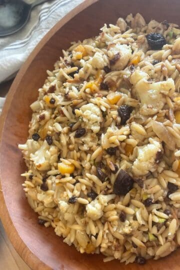 Roasted Cauliflower, Dried Fruit, and Pistachio Orzo Salad with Citrus Cumin Dressing