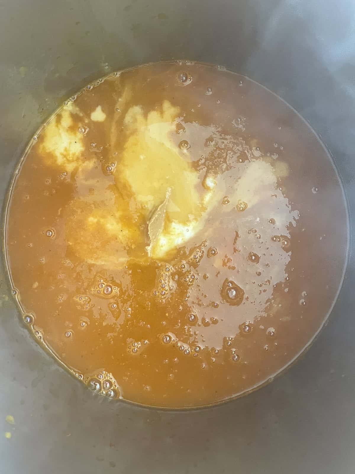 West African Peanut Soup with Chicken and Chickpeas adding coconut milk and peanut butter