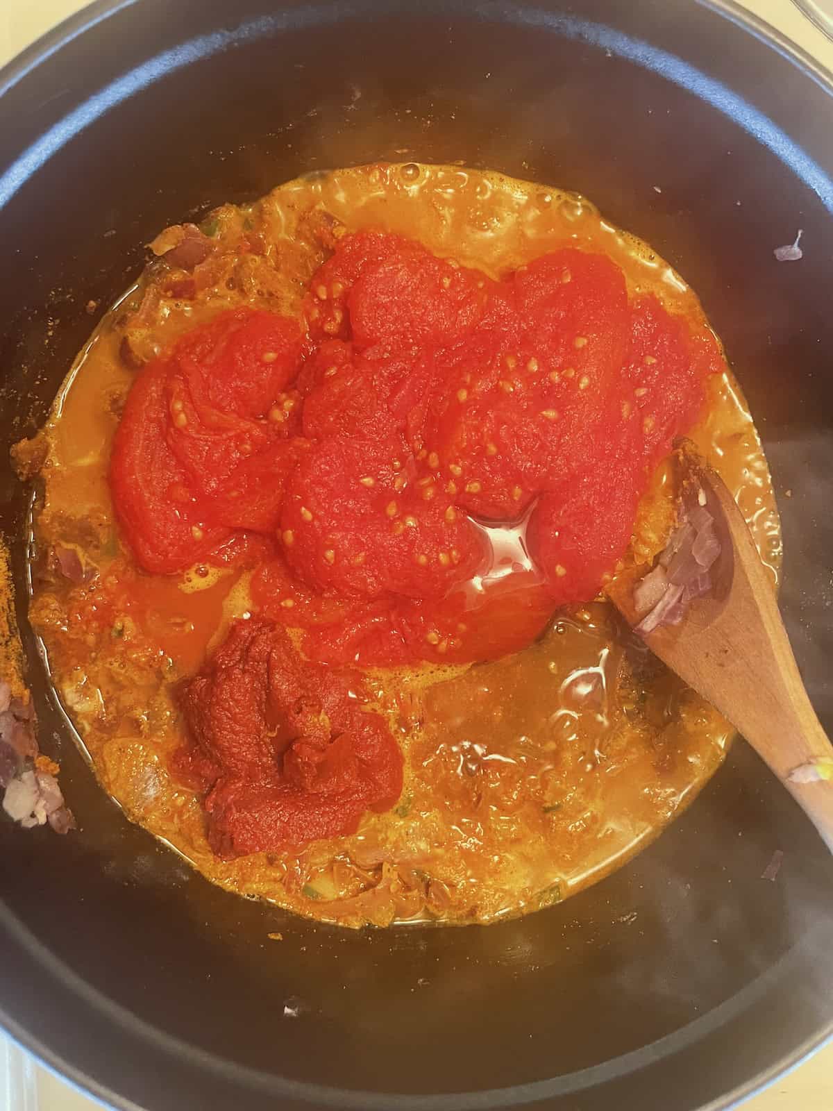 West African Peanut Soup with Chicken and Chickpeas adding tomatoes and honey