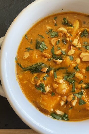 West African Peanut Soup with Chicken and Chickpeas in a bowl