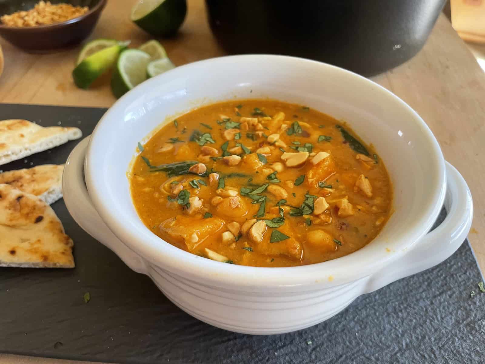 West African Peanut Soup with Chicken and Chickpeas in a bowl