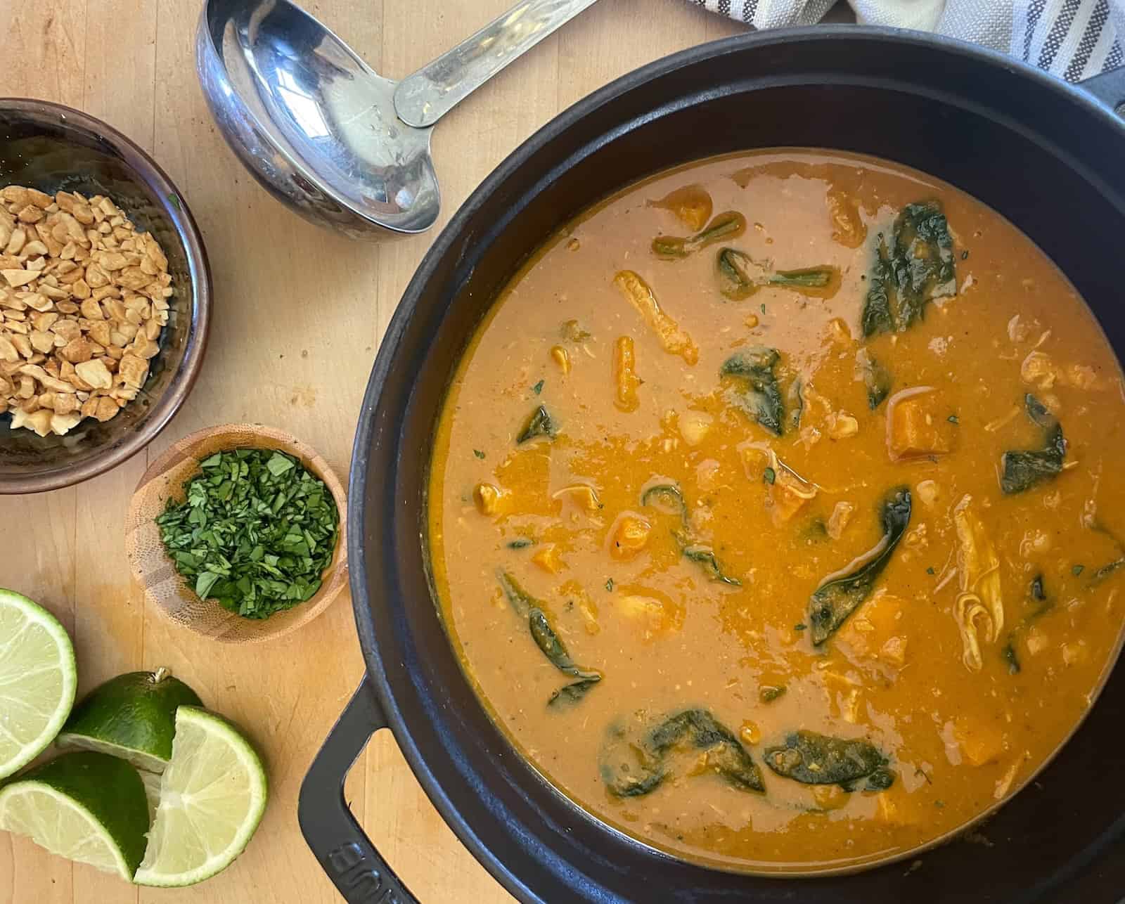 West African Peanut Soup with Chicken and Chickpeas - soup pot with garnishes