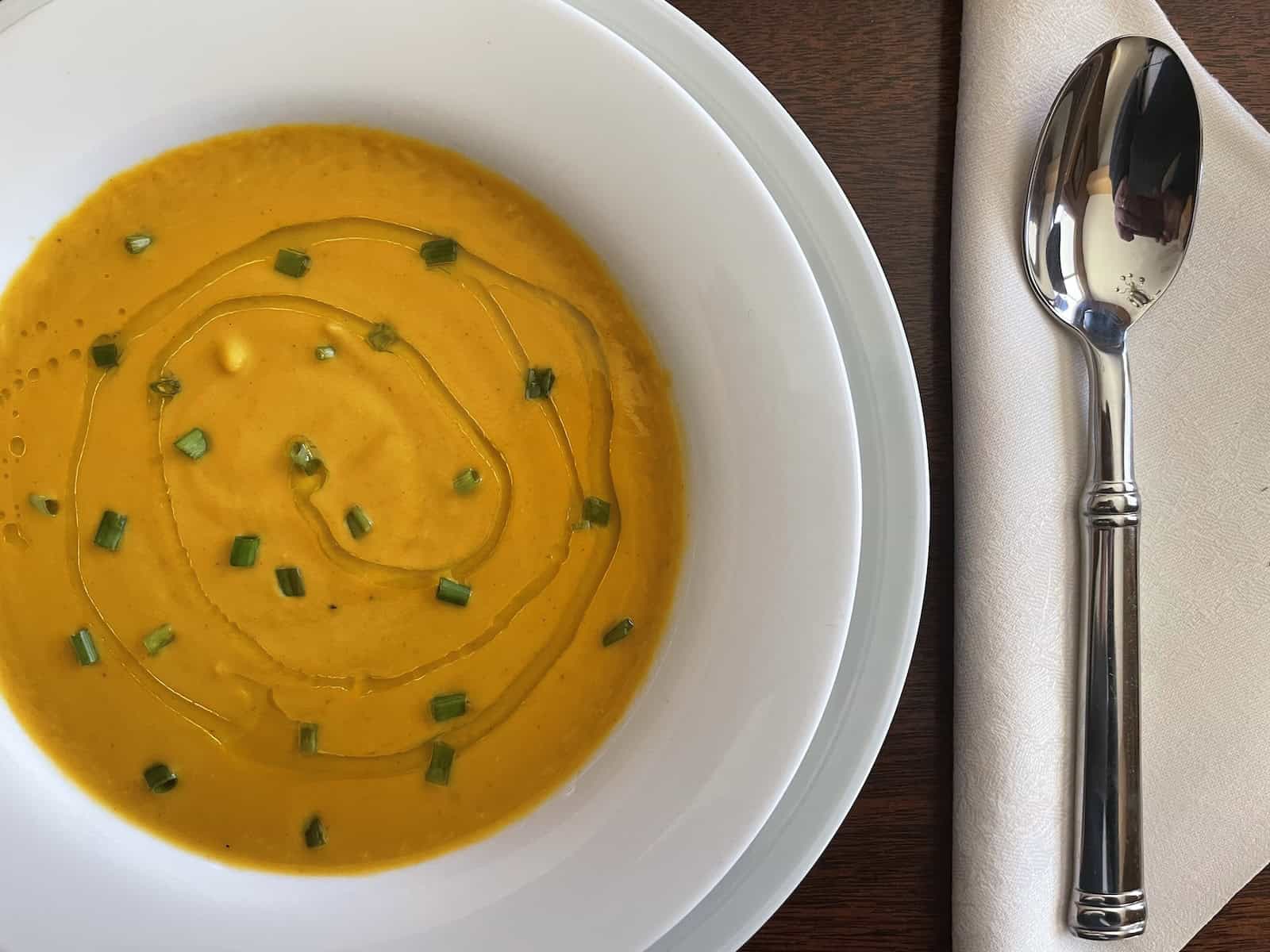 Butternut Squash Soup with Bacon and Brandy with orange-infused olive oil drizzle