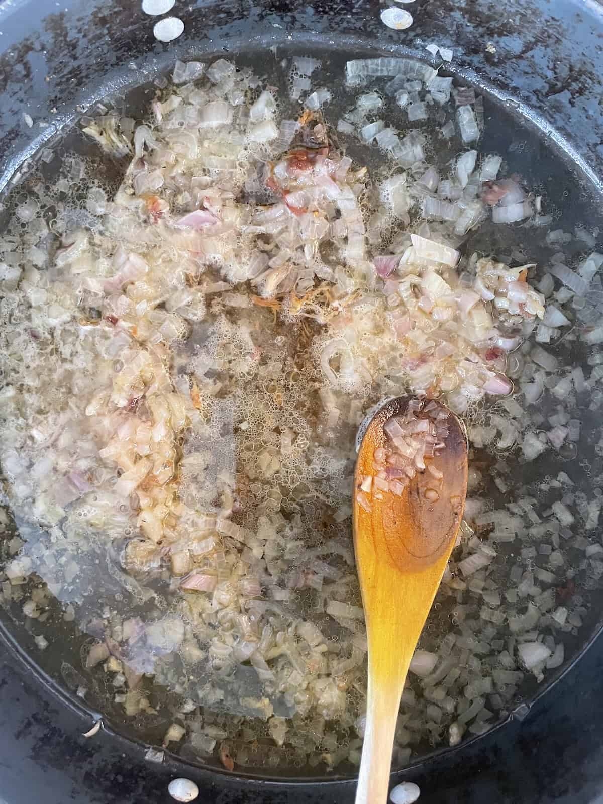 Adding wine to sautéed shallots