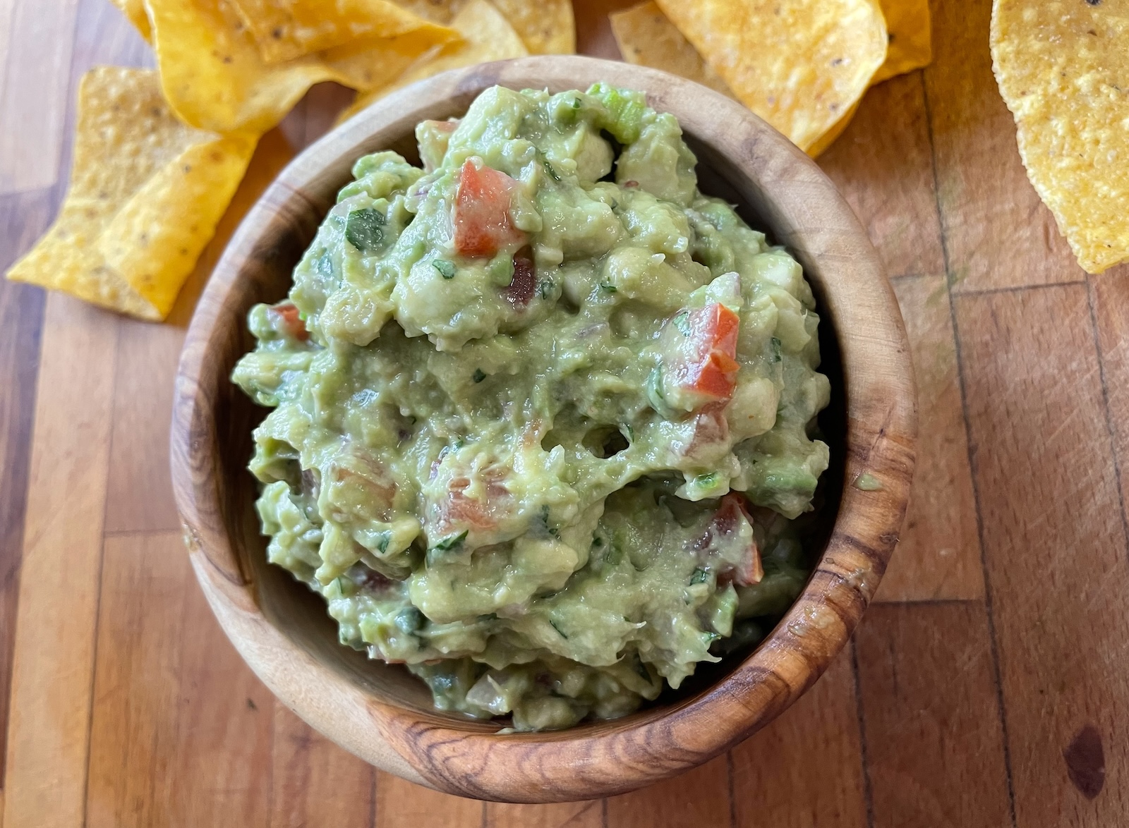 guacamole in serving dish with chips