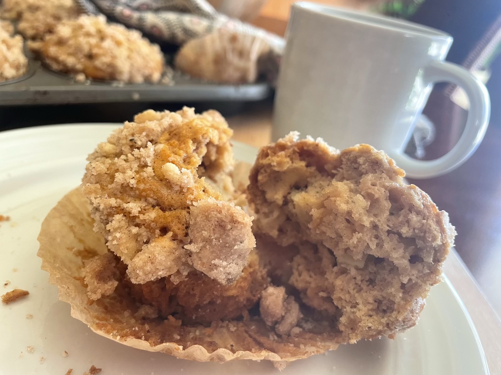 Brown Butter Toffee Apple Muffins -- broken open muffin on plate