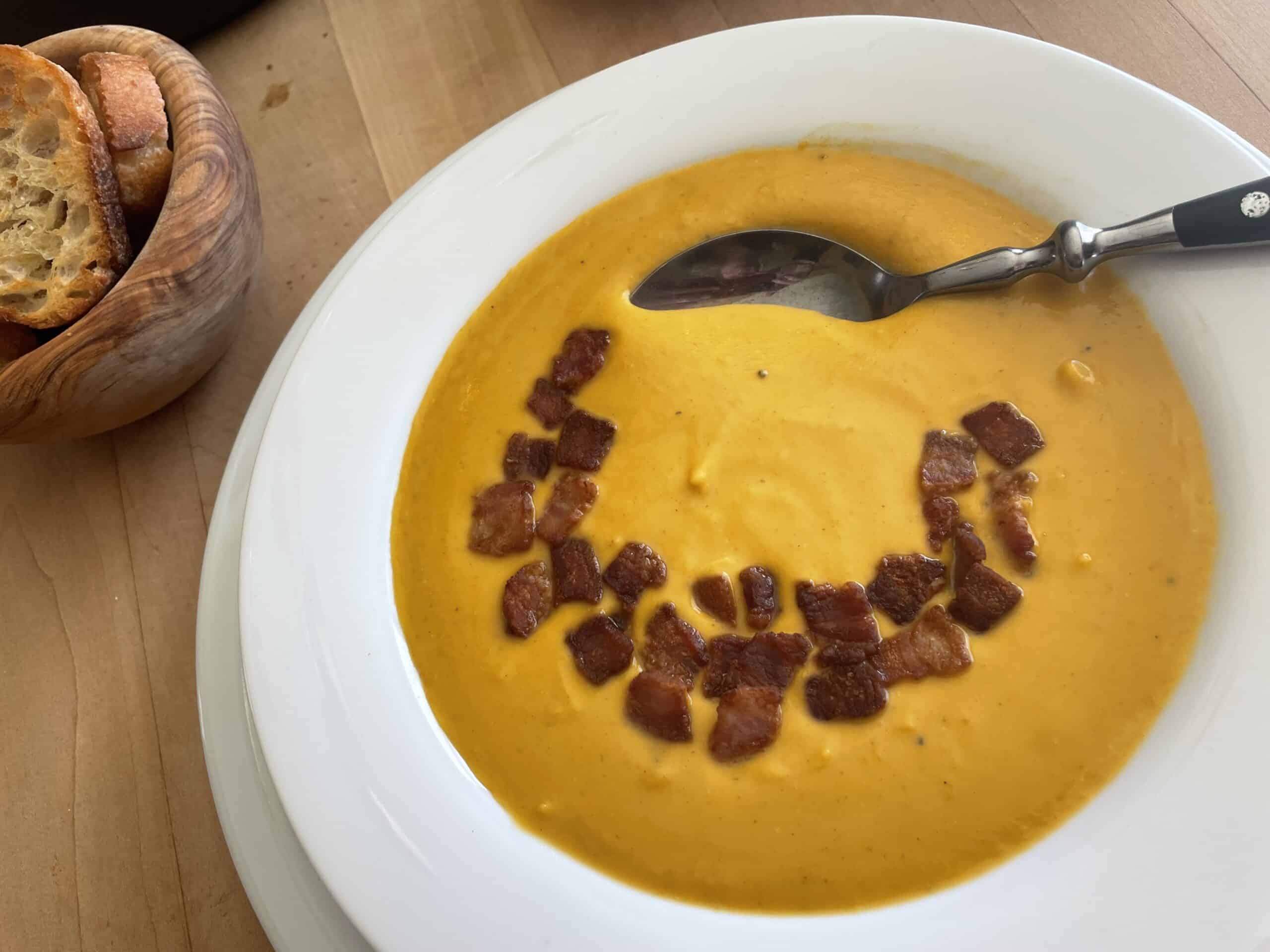 Butternut Squash Soup with Bacon and Brandy in a bowl