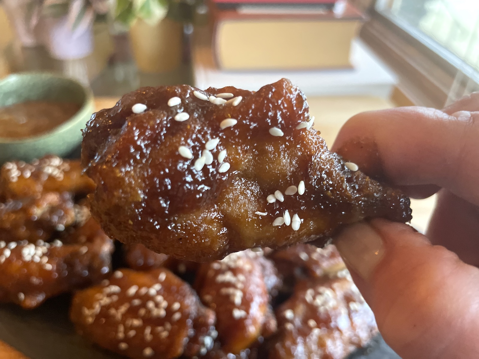 Polynesian Chicken Wings with Pineapple Mustard Sauce -- getting ready to bite into a wing