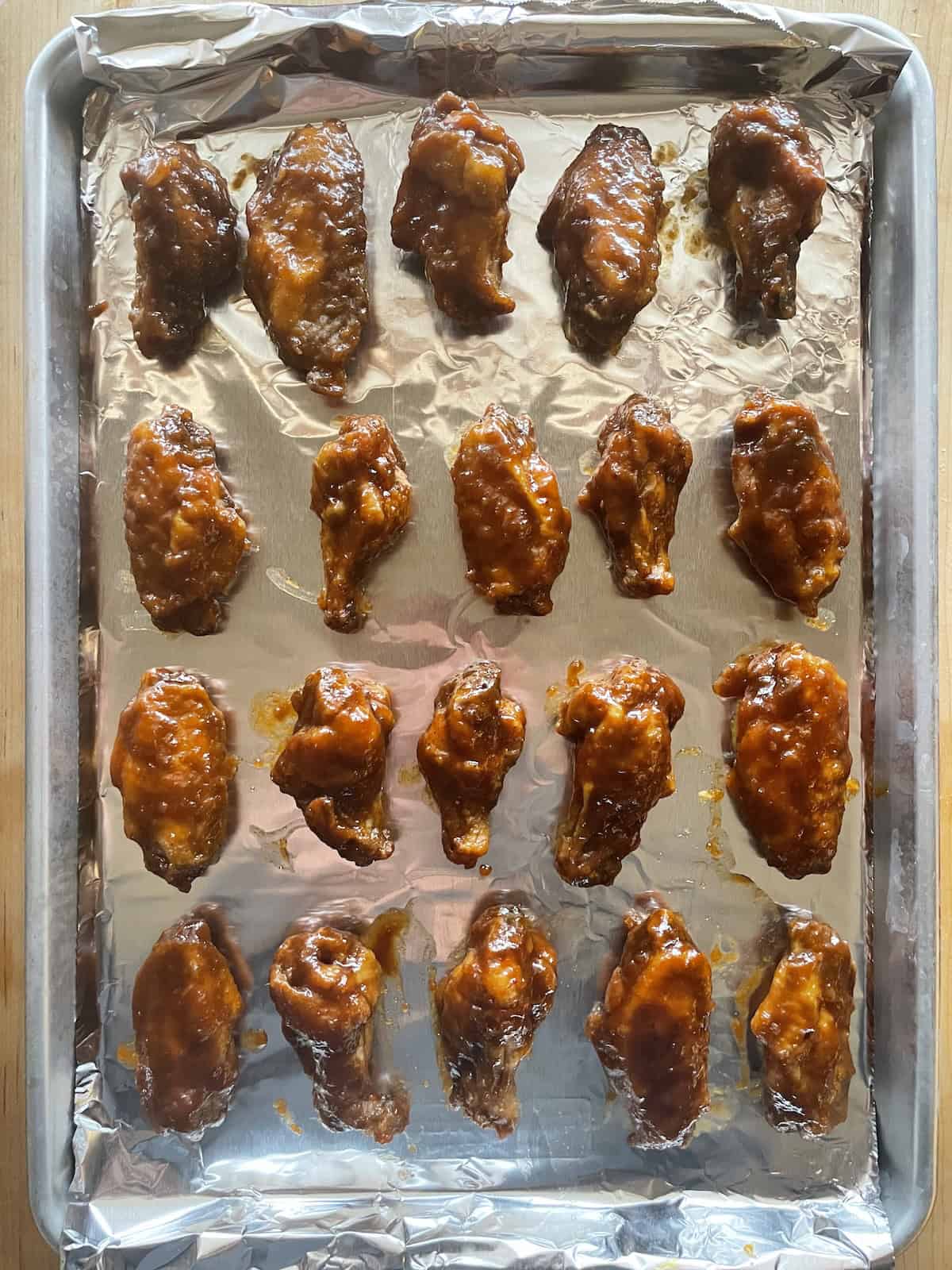 Polynesian Chicken Wings with Pineapple Mustard Sauce - wings on baking sheet