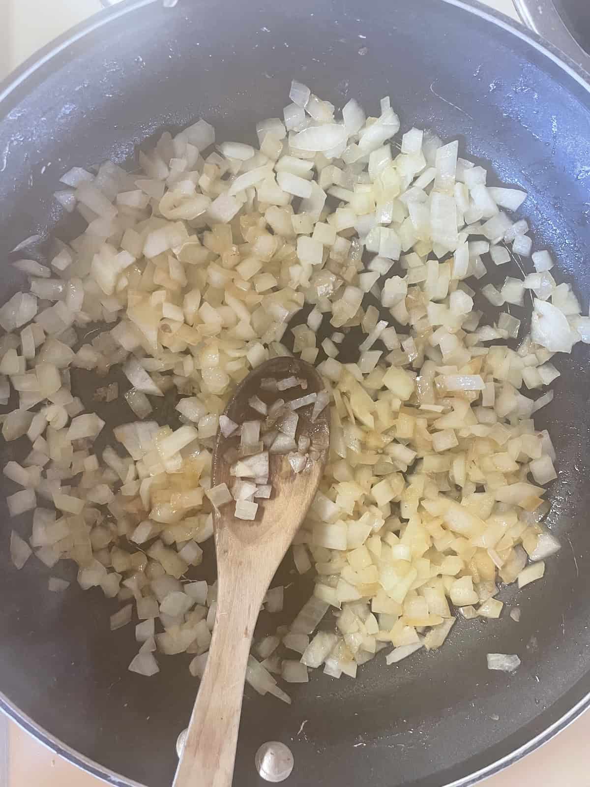 Sausage and Mushroom Rigatoni with Marsala and Parmesan -- sautéing onions