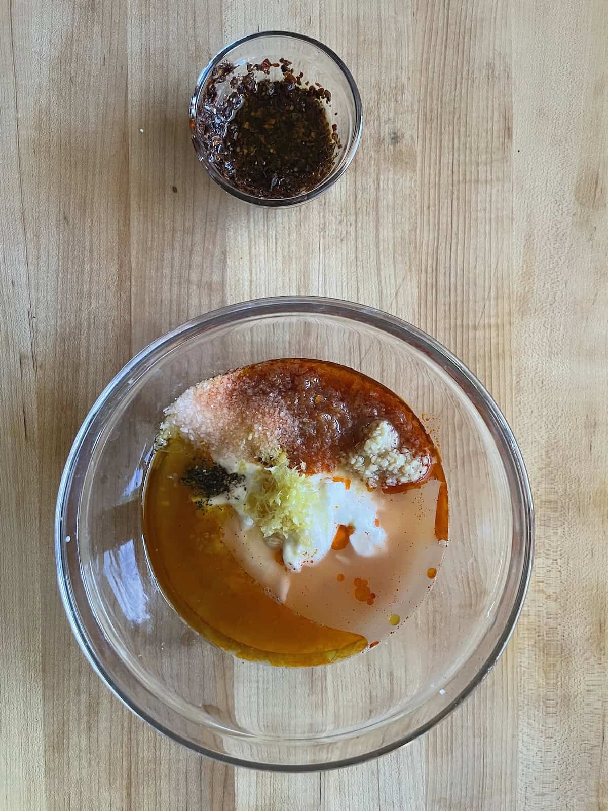 combining chicken marinade ingredients