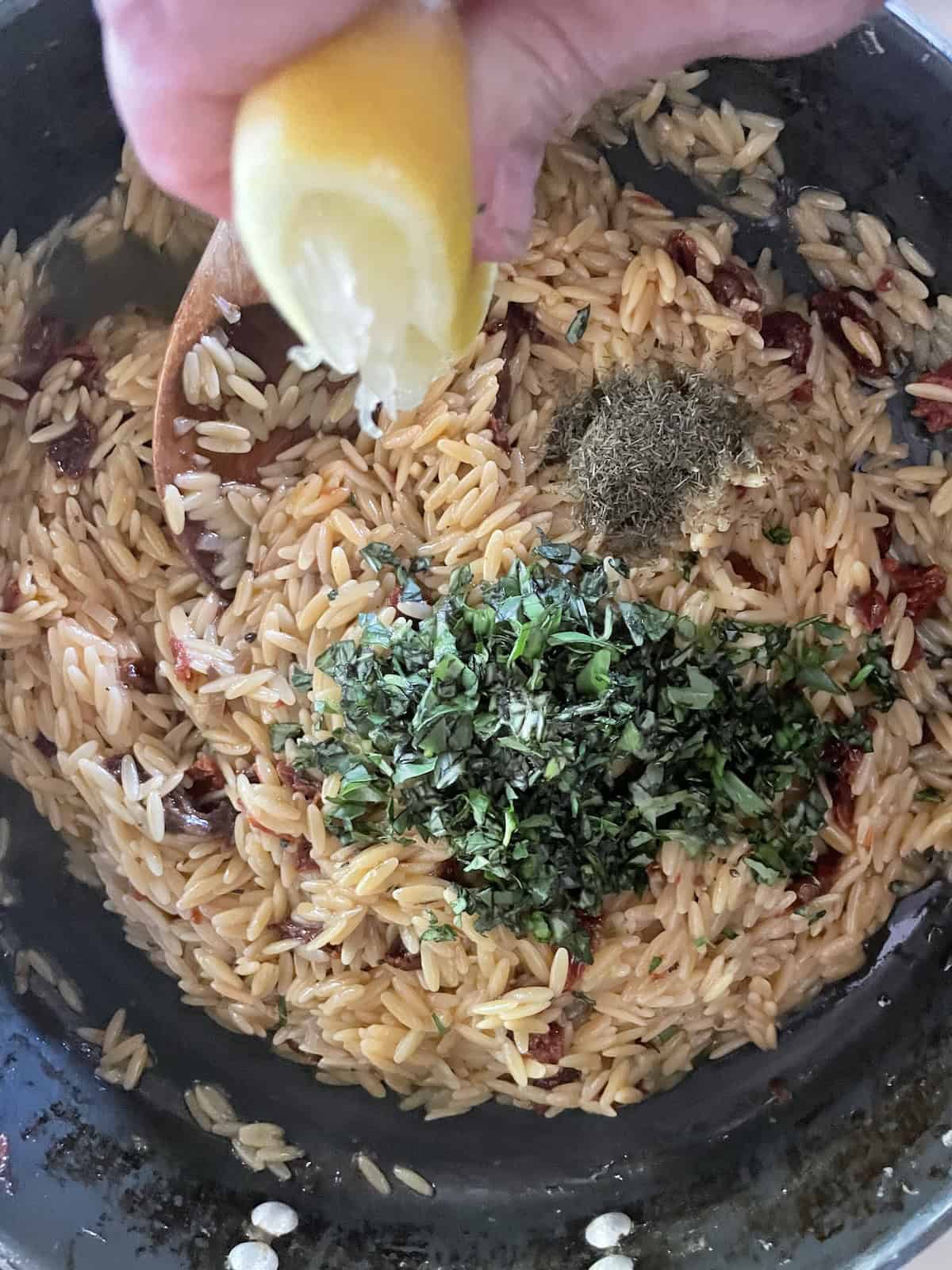 add lemon juice and basil to orzo
