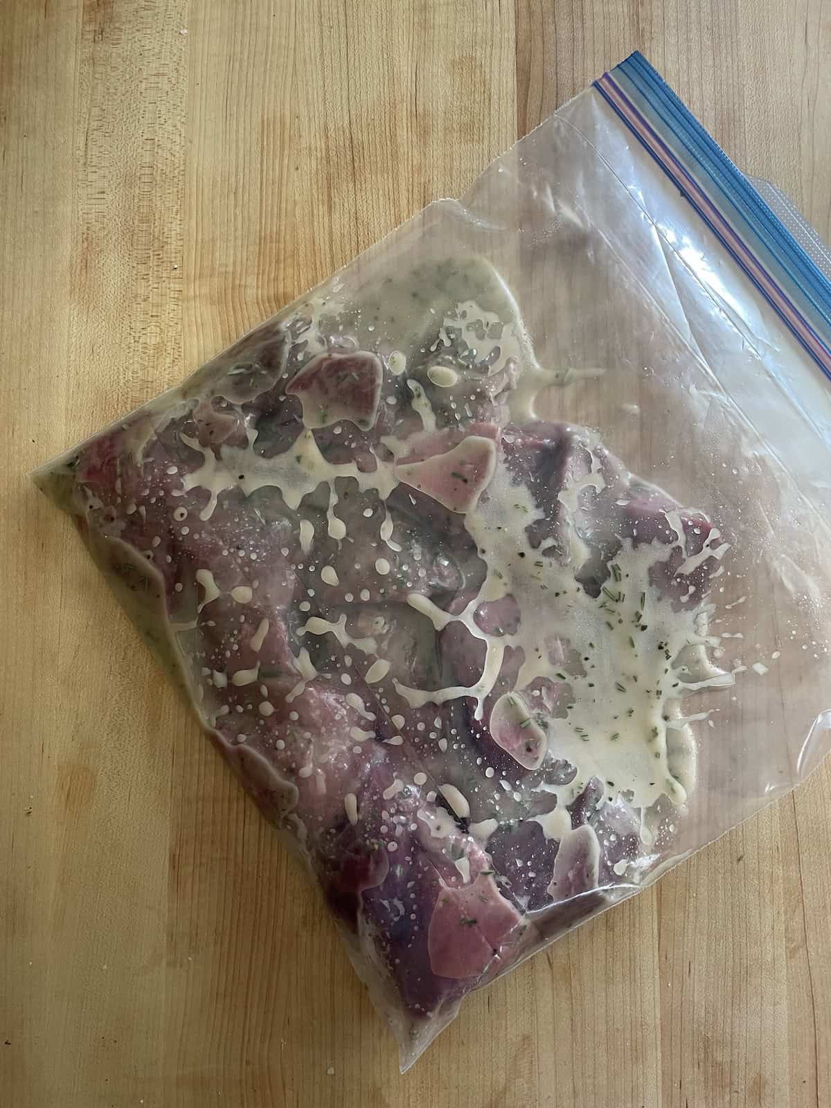 beef marinating in a zipper bag