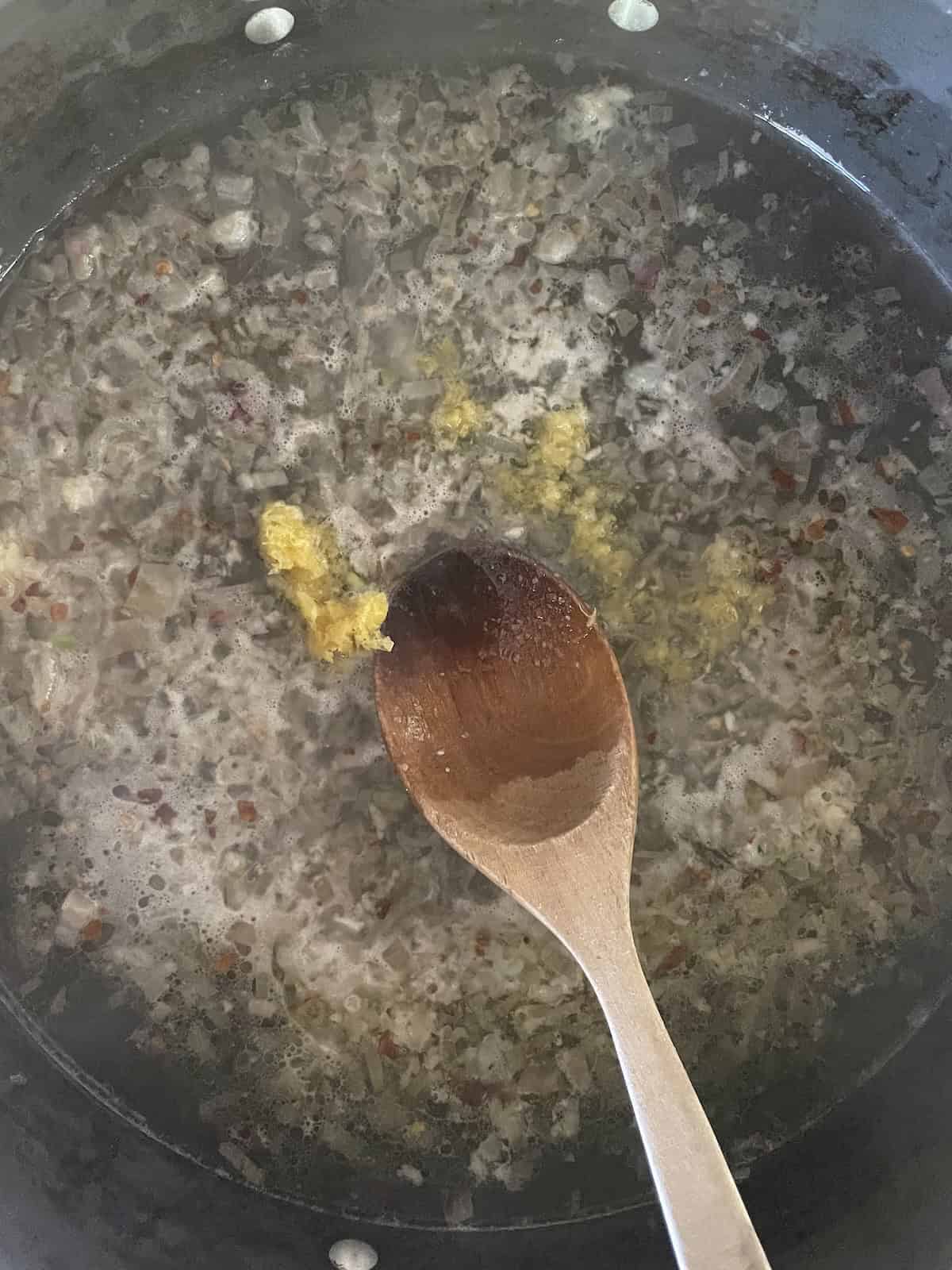 add lemon zest and wine
