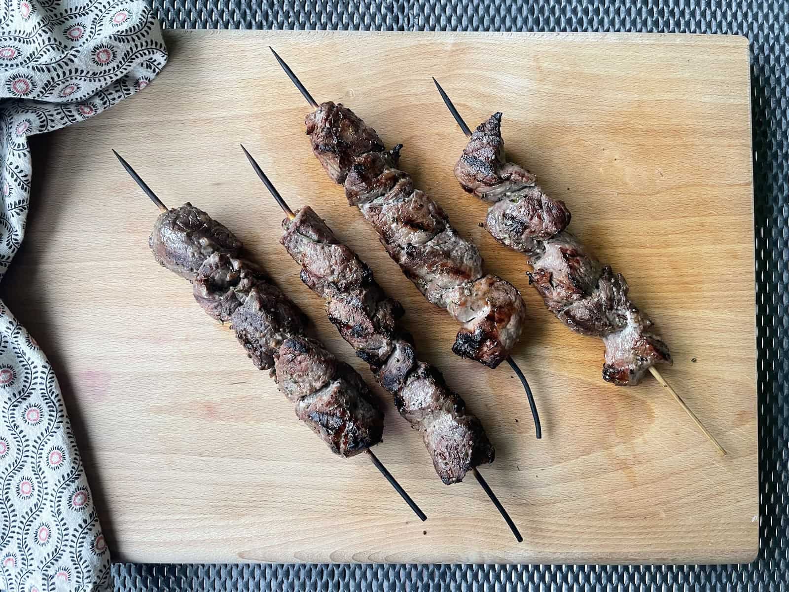 beef kebabs on a serving board