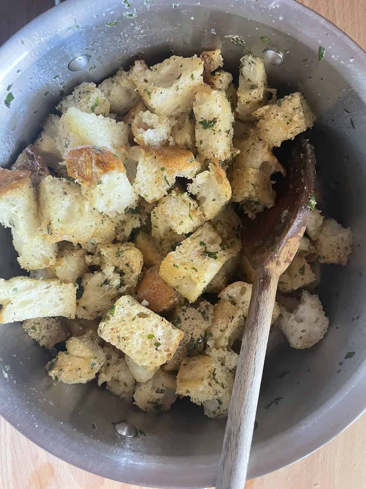 tossing bread with browned butter