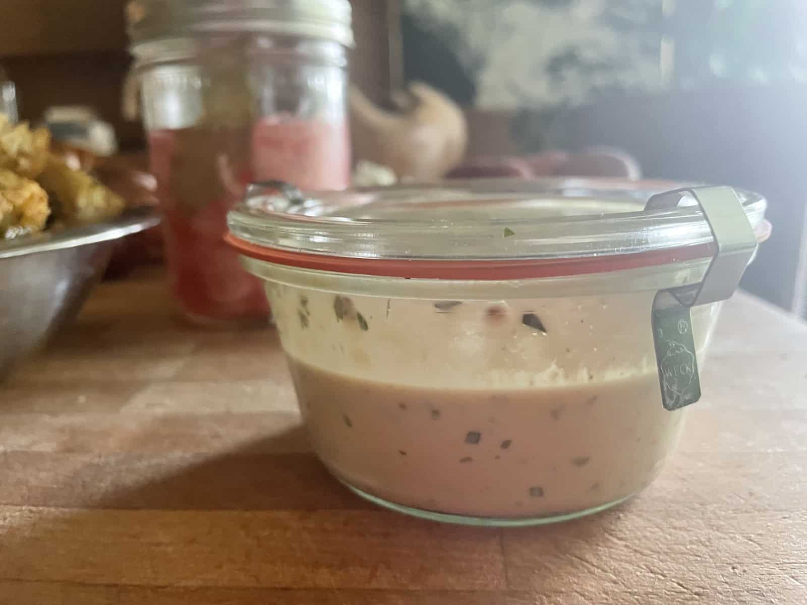 Miso Buttermilk Salad Dressing with Fresh Herbs in a jar