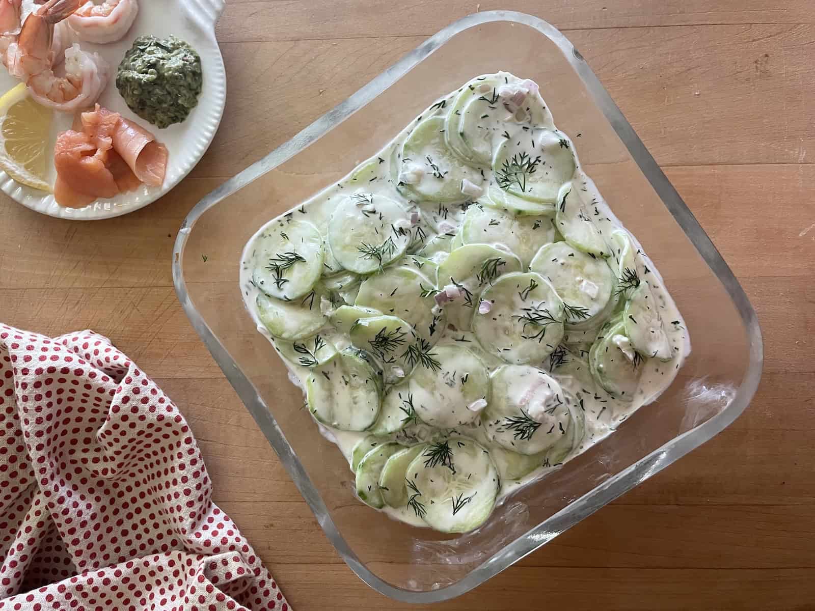 Creamy dill cucumbers  in a serving bowl