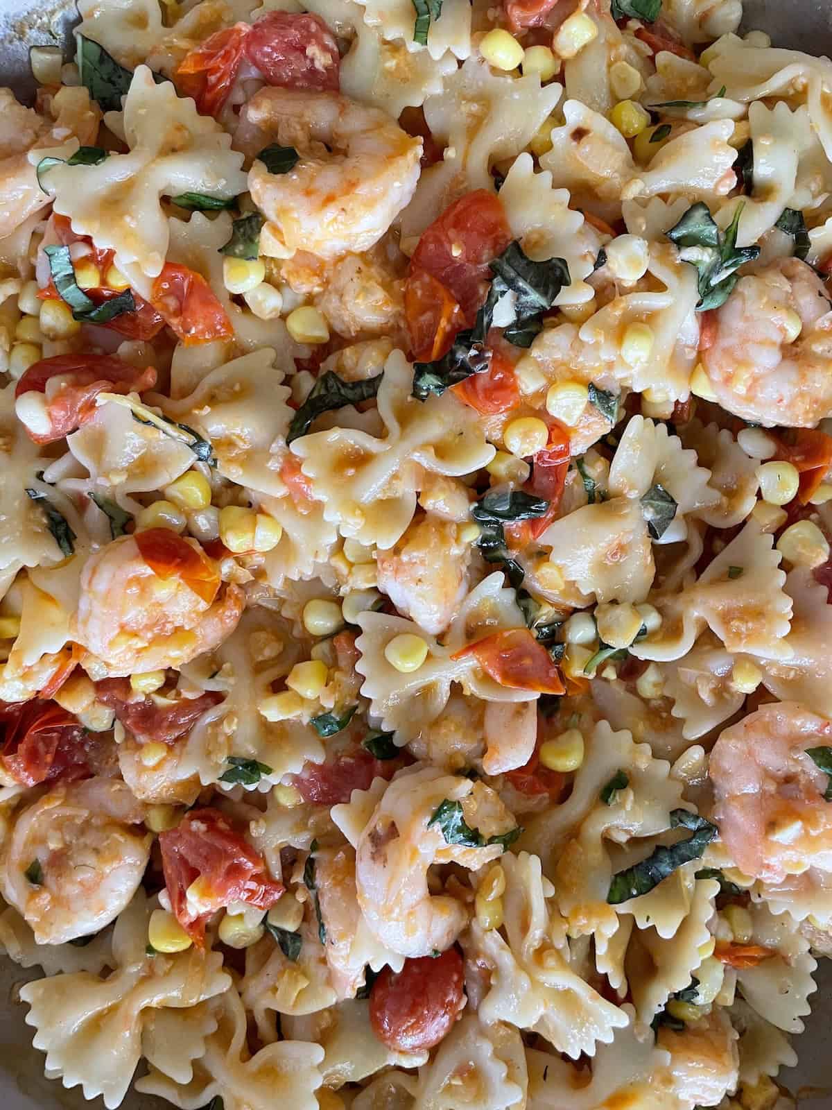tossing with pasta in skillet