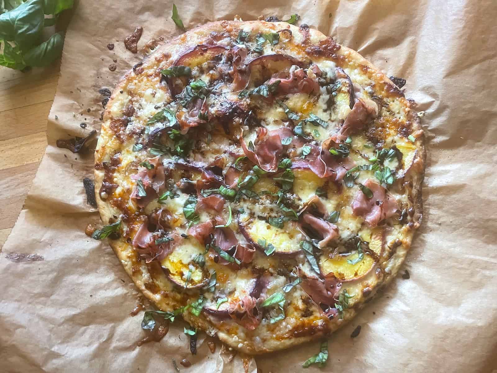 Peach and prosciutto pizza