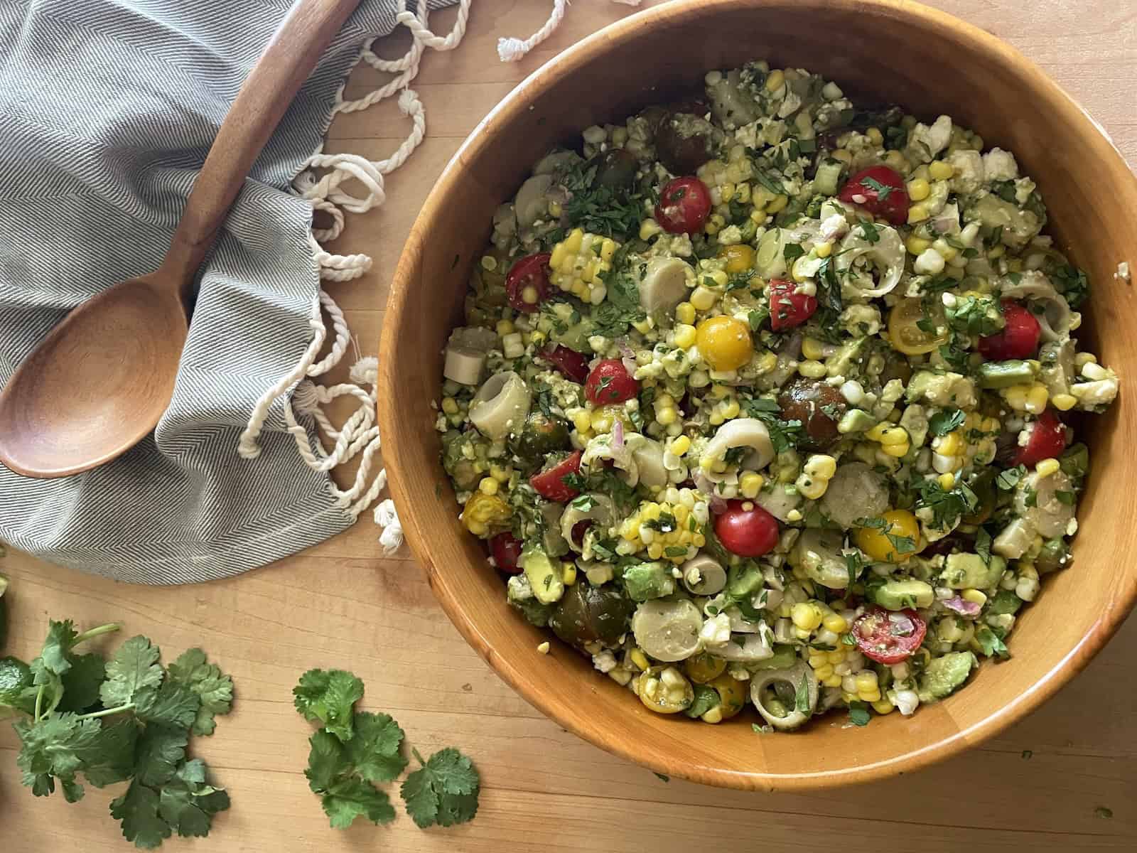 Corn, Tomato, Avocado and Hearts of Palm Salad in a bowl