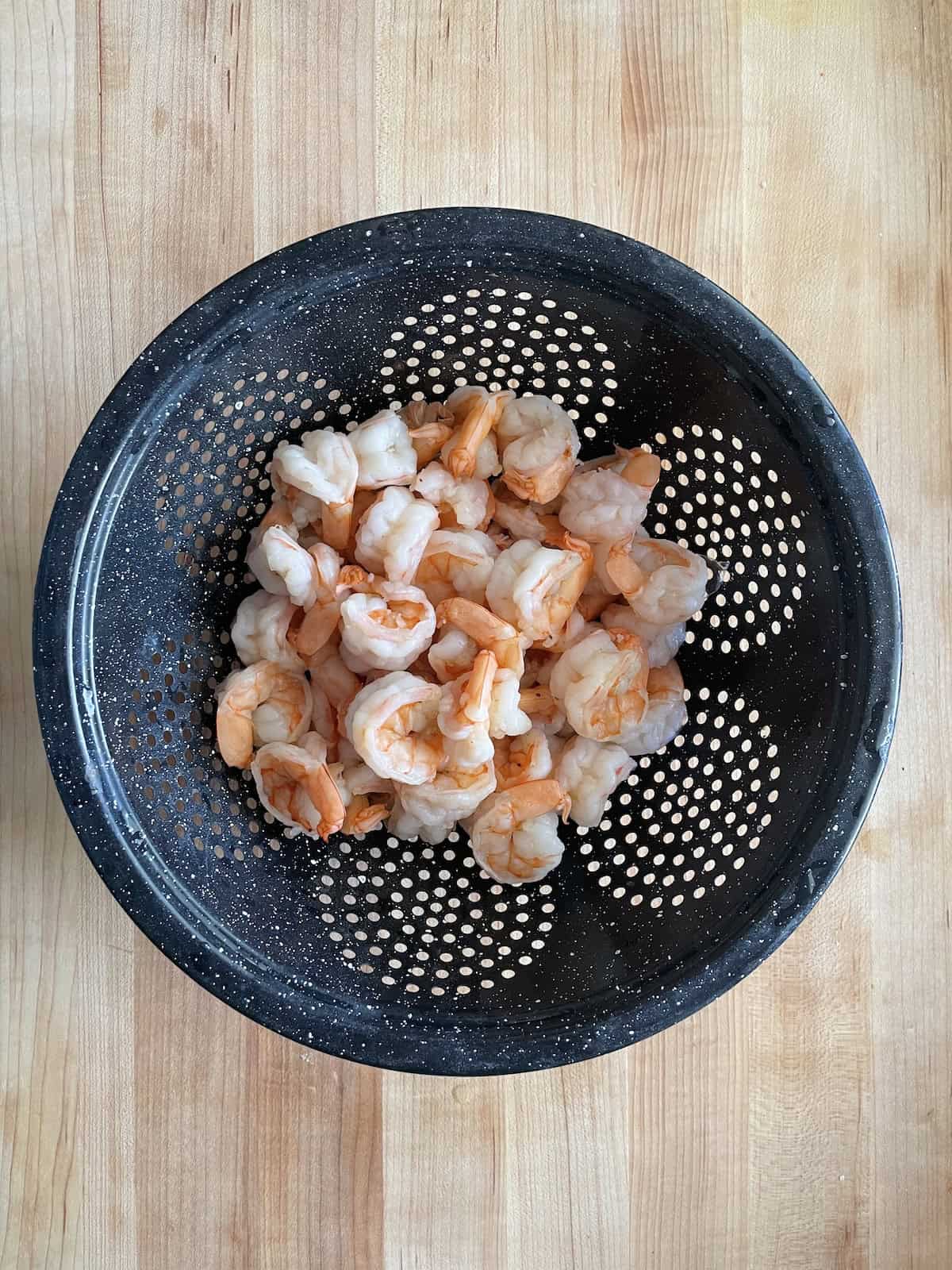shrimp draining in a colander