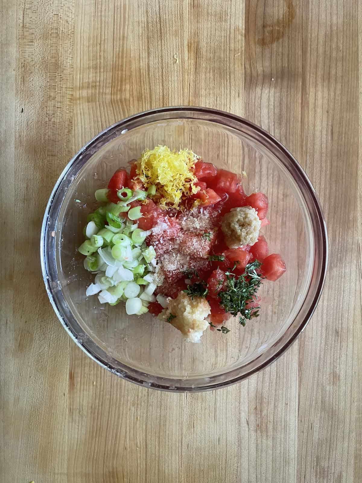 tomato topper ingredients in a bowl