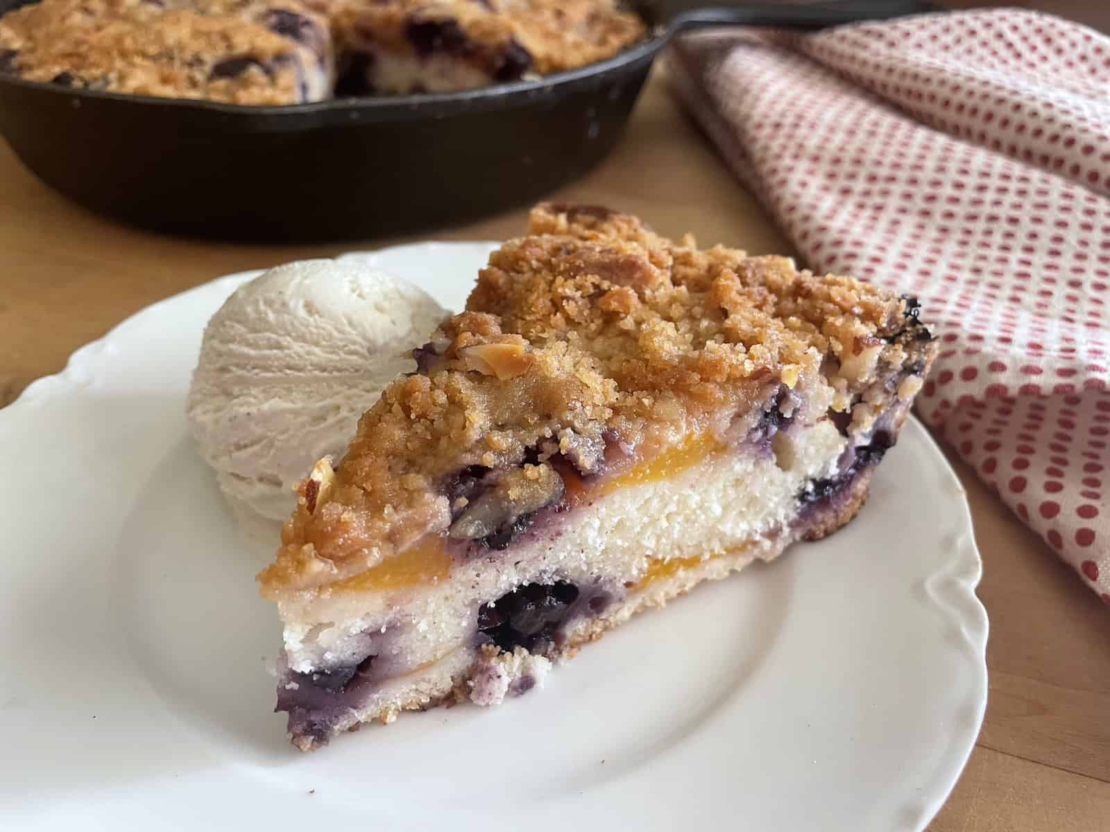 Peach and Blueberry Buttermilk Buckle with Almond Streusel on a plate