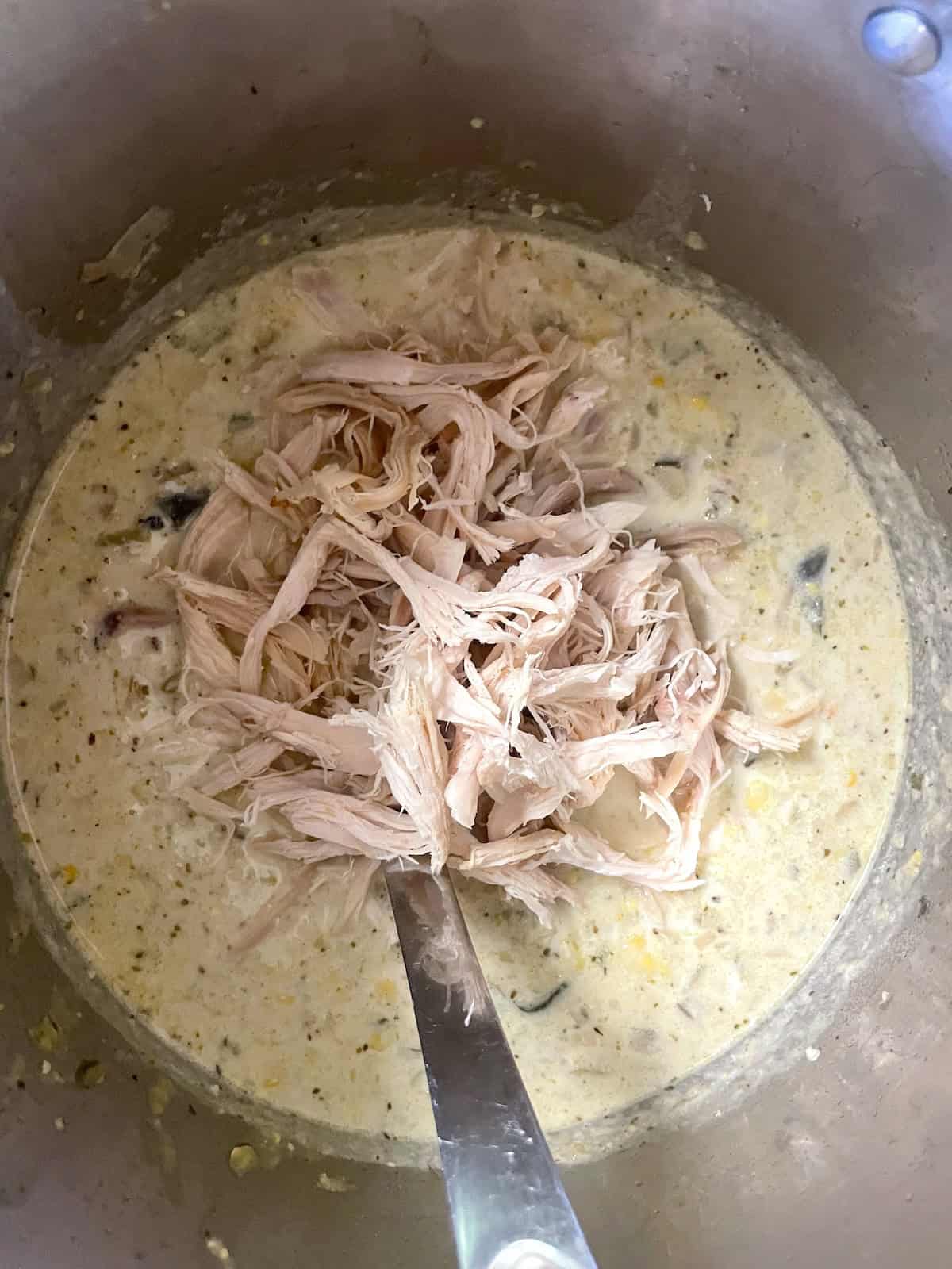 milk, cream and chicken added to the pot