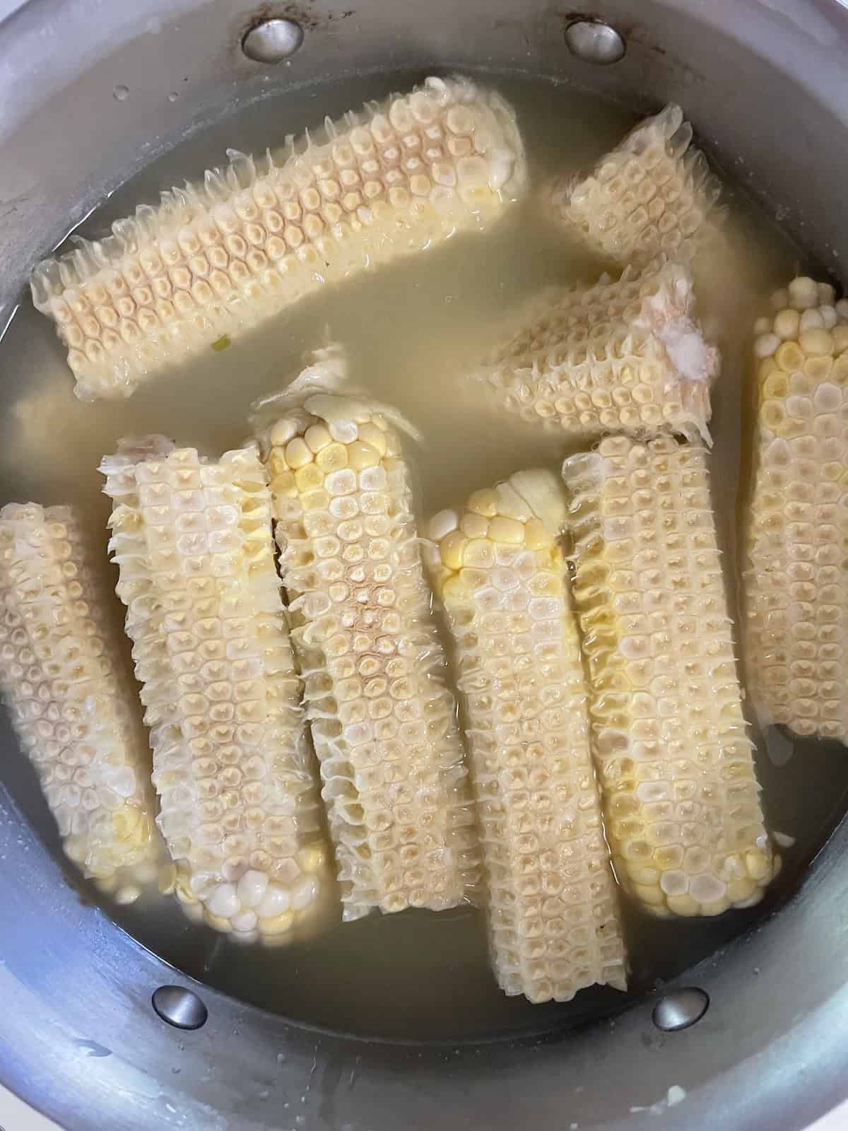 corn cobs simmering ni chicken broth