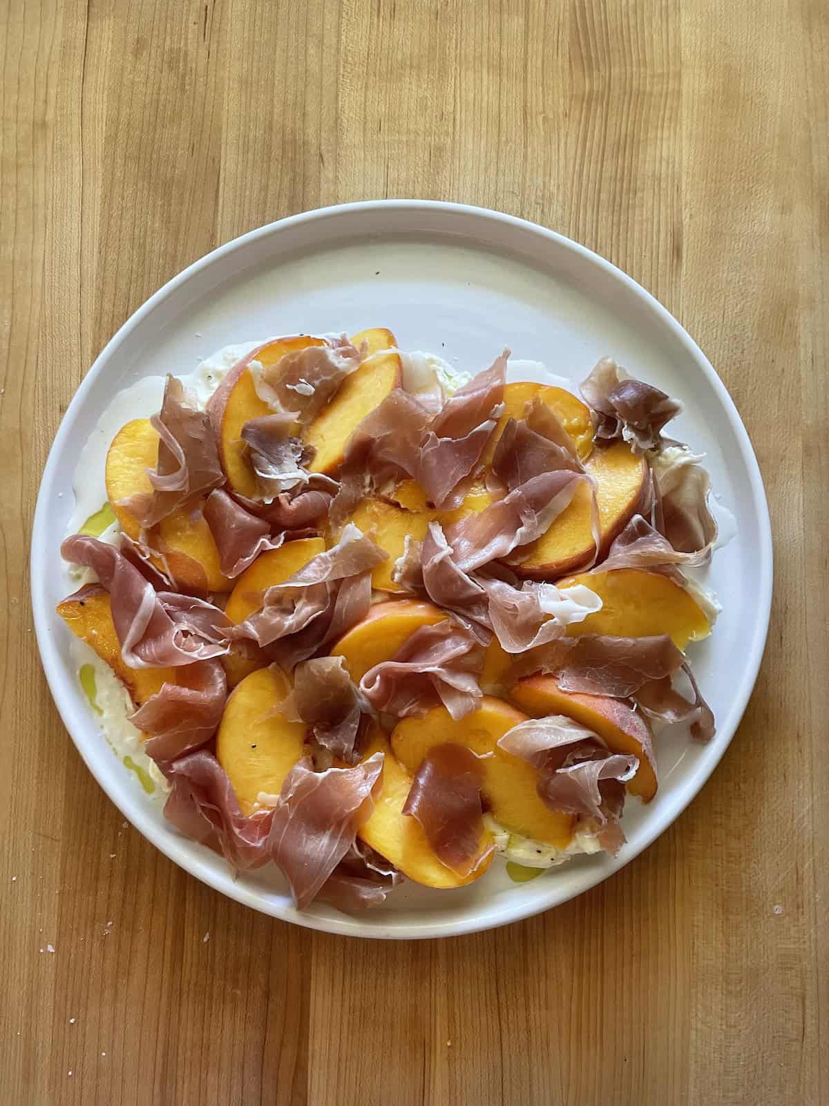 top with prosciutto