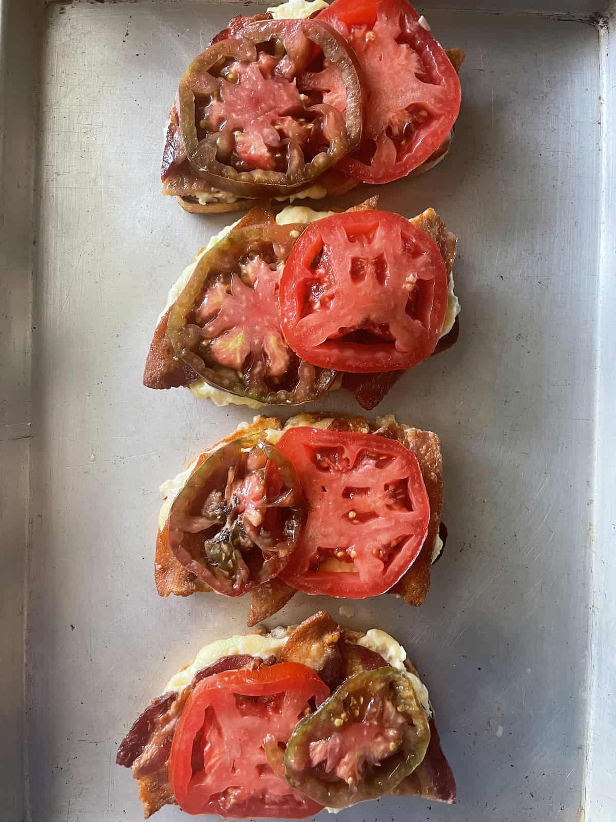 adding tomato slices