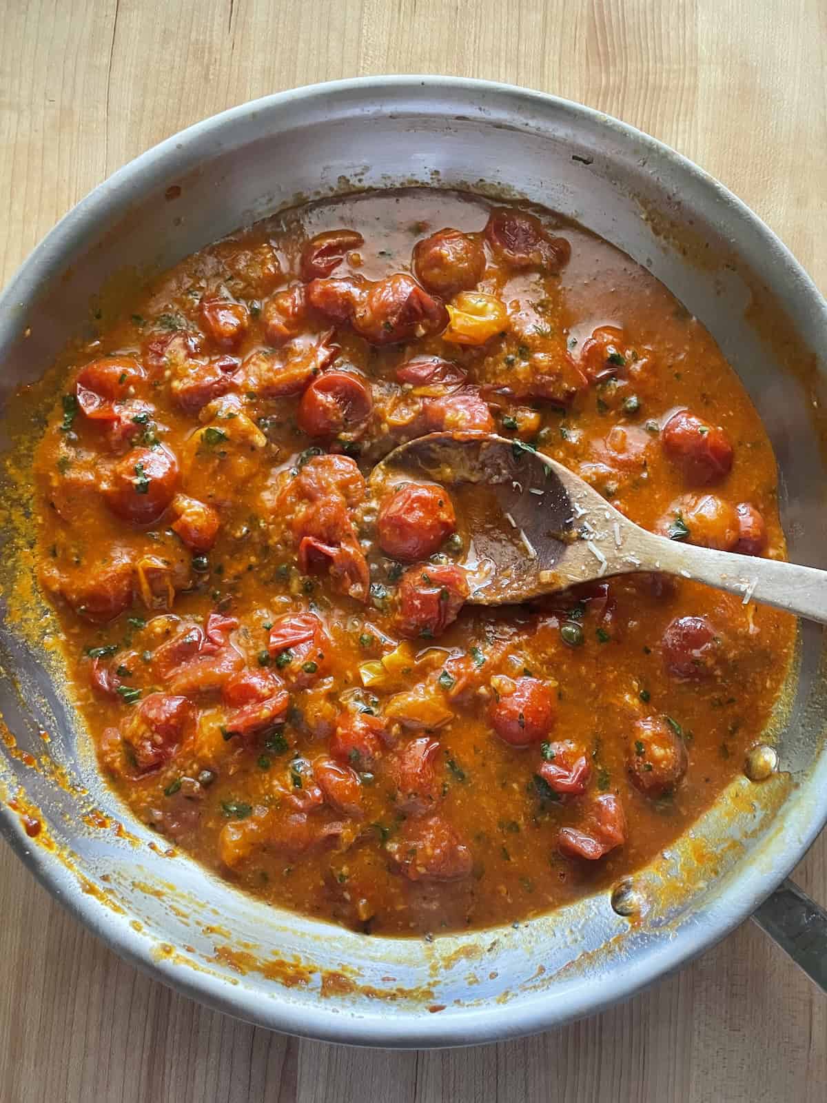 cookBurst Cherry Tomato Sauce and Pasta until thickened
