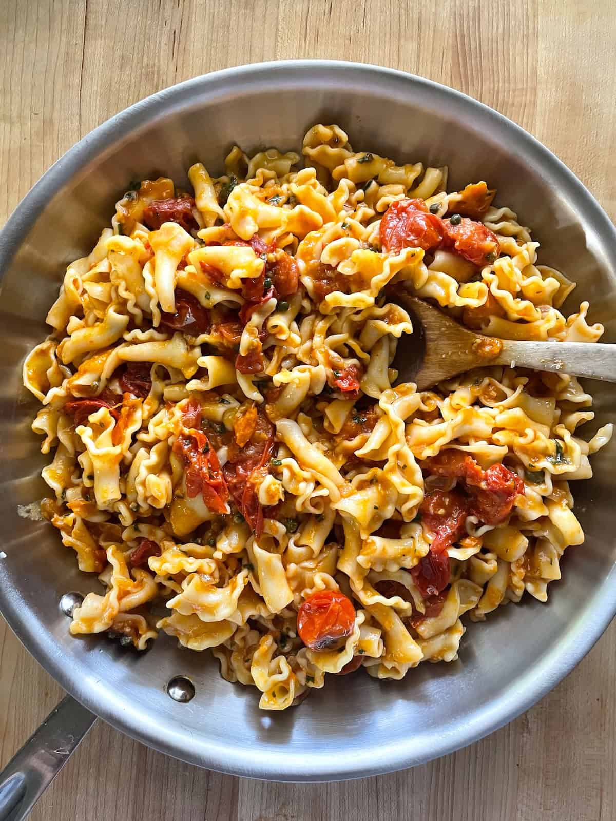 Add pasta and combine with Burst Cherry Tomato Sauce