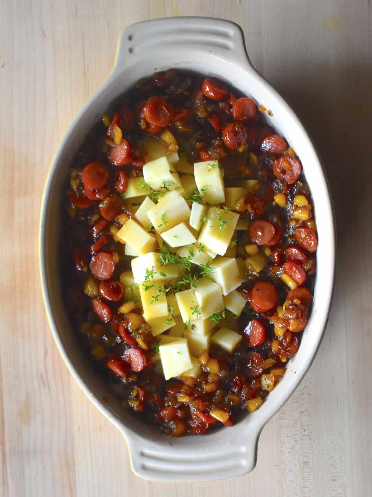 cheese cubes and Baked Gruyere “Fondue” with Smokie and Apple Jam in a baking dish