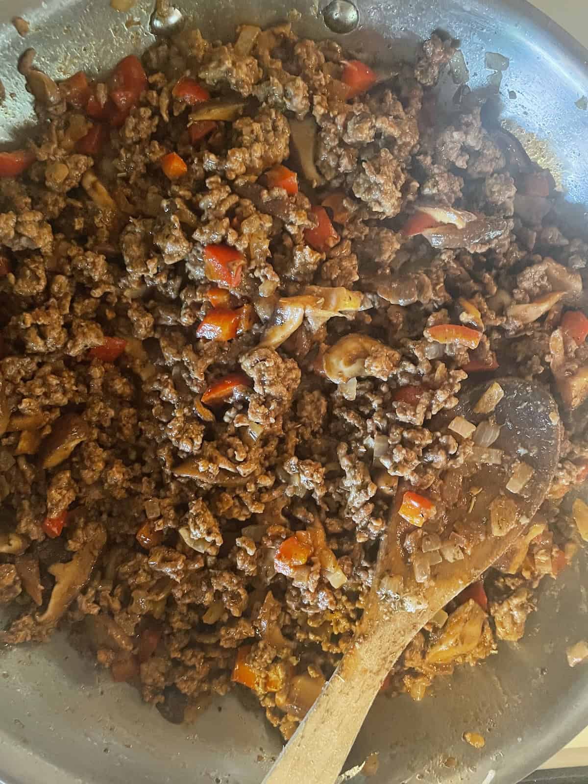 add tomato paste and herbs and spices