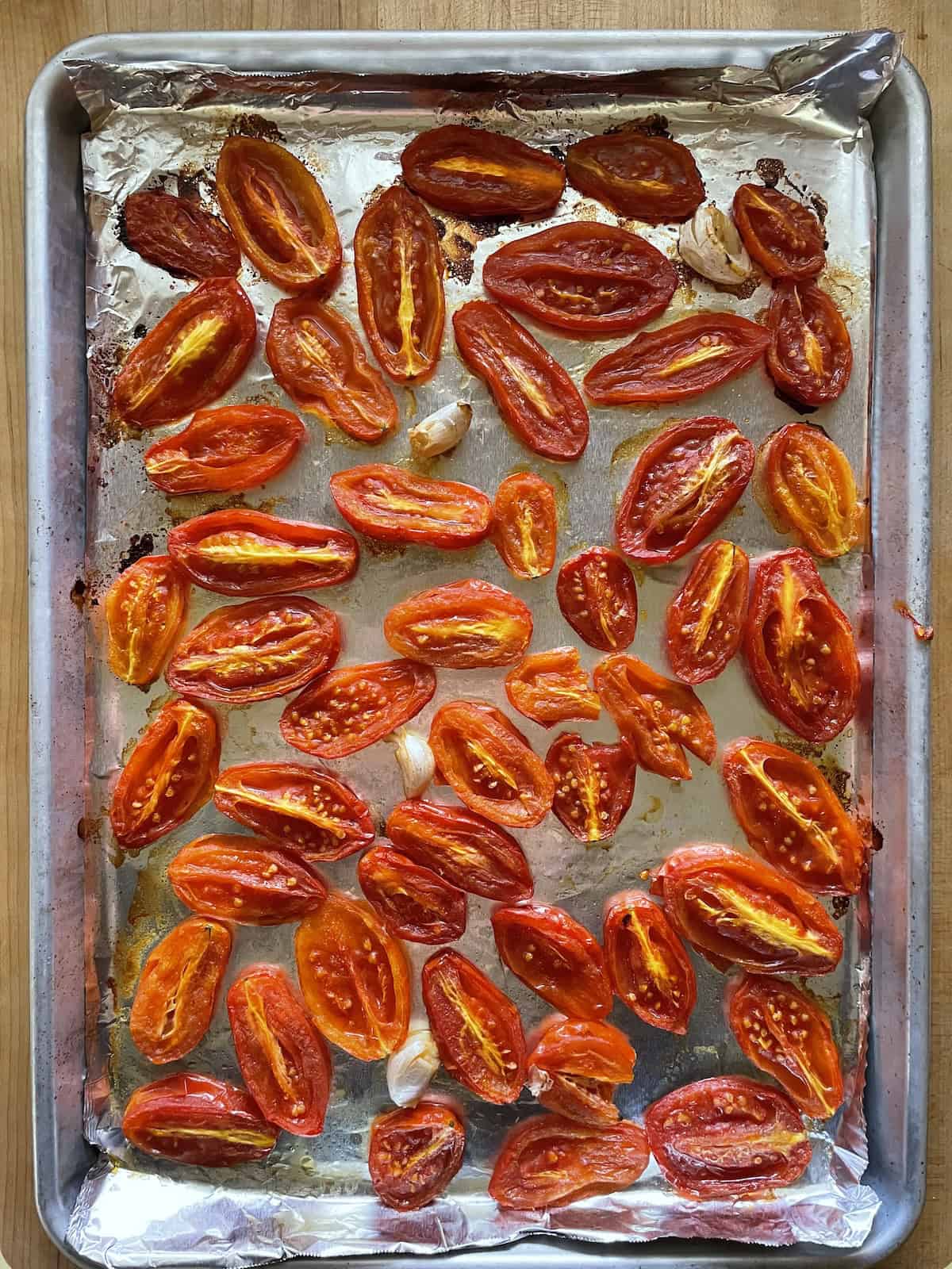 roasted tomatoes on baking sheet
