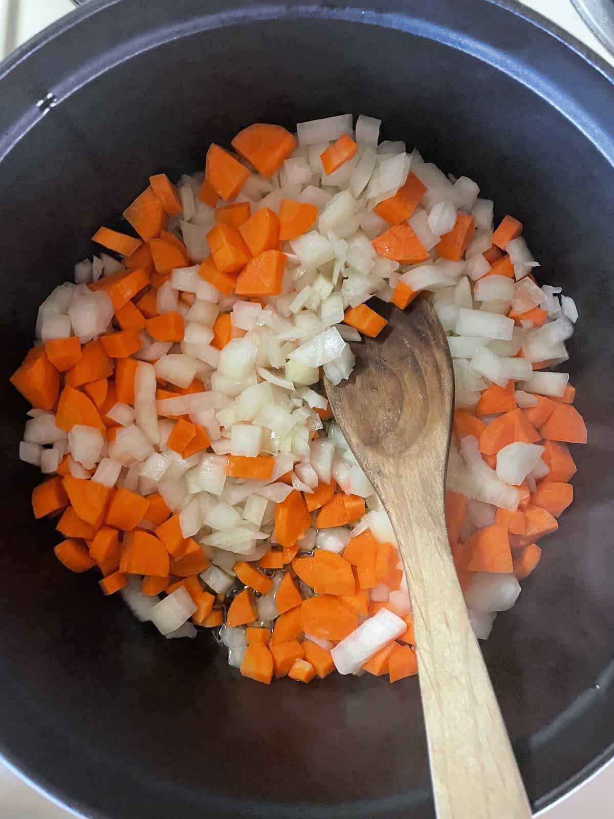 onions and carrots in dutch oven